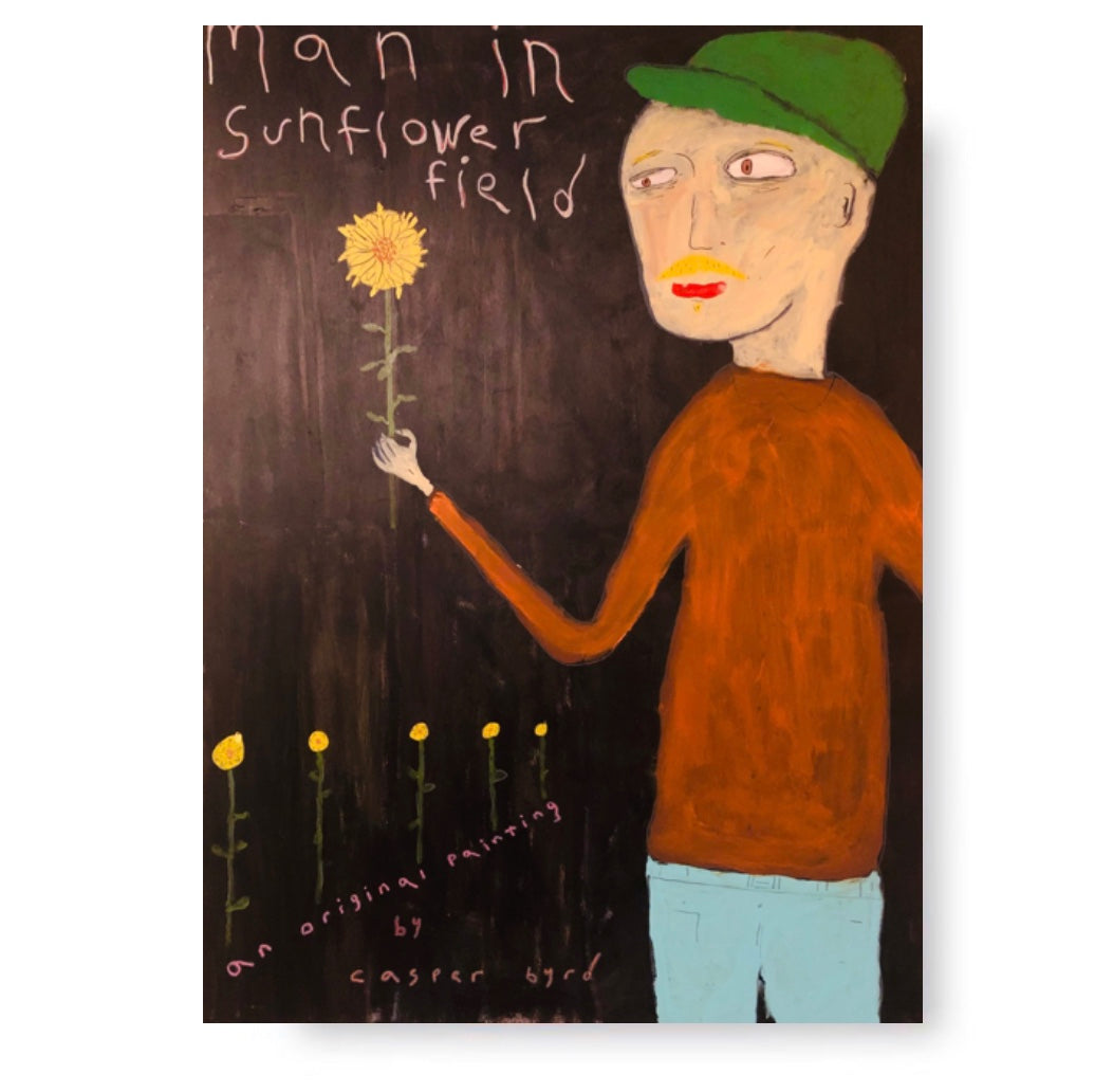 man in sunflower field